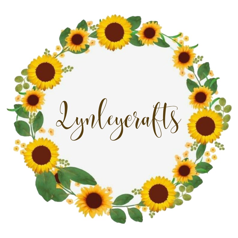May include: A wreath of yellow sunflowers and green leaves with the text "Lymleycrafts" in the center.