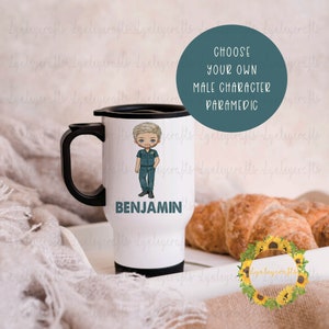 May include: White travel mug with a black handle and lid. The mug features a cartoon image of a male paramedic with blonde hair and a blue uniform. The name "BENJAMIN" is printed in black below the image.