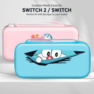 May include: Two custom-made cases for SWITCH 2 / SWITCH. The front case is light blue with a cartoon character graphic. The back case is pink with a cartoon character graphic. The cases have zippers and are designed to fit the model.