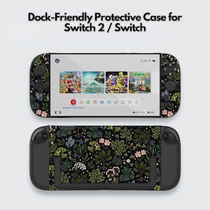 May include: A black protective case for a Switch 2 / Switch, featuring a floral pattern with green leaves and pink flowers. The screen displays game icons. The text "Dock-Friendly Protective Case for Switch 2 / Switch" is at the top.