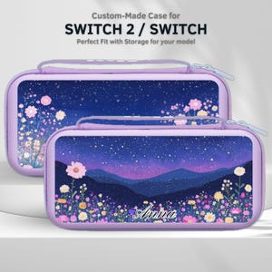 May include: Two lilac Switch 2 / Switch cases with a starry night design. The cases feature a floral landscape with the name "Anna" and the text "Custom-Made Case for SWITCH 2 / SWITCH Perfect Fit with Storage for your model".