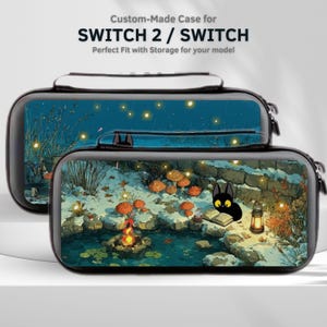 May include: Two black custom-made cases for SWITCH 2 / SWITCH. The cases feature a colorful illustration of a winter scene with a black cat reading a book near a pond and a campfire. The top case has a similar illustration with a night scene.