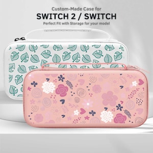 May include: Two custom-made cases for SWITCH 2 / SWITCH. One case is white with a green leaf pattern, and the other is pink with a floral design. Both cases have a zipper closure and a handle.