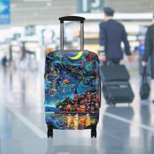 May include: A rolling suitcase with a colorful, artistic design. The artwork depicts a night scene with a village, water, and a crescent moon. The suitcase has a telescoping handle and four wheels.