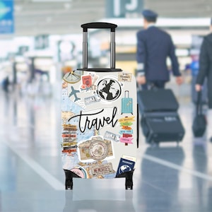 May include: A white travel suitcase featuring a travel-themed design. The suitcase is adorned with travel stickers, a world map, a compass, and the word "travel" in cursive. A blue suitcase sticker is also visible.