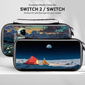 May include: Two black rectangular carrying cases for gaming consoles. The back case features an astronaut in a field of flowers under a sunset sky. The front case displays an astronaut sitting by a red tent on a moonlit lunar surface.