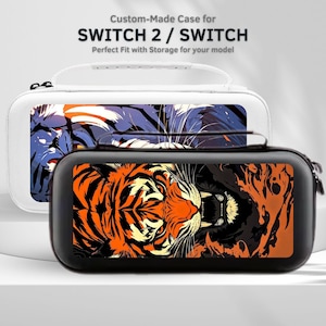 Puede incluir: Dos fundas para consolas de juegos Switch. Una es negra con un diseño de tigre naranja y negro. La otra es blanca con un diseño de tigre azul y morado. Las fundas tienen cierre de cremallera y asa. El texto de la imagen dice "Custom-Made Case for SWITCH 2 / SWITCH".