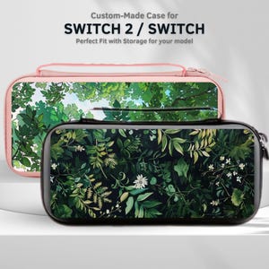 May include: Two custom-made cases for SWITCH 2 / SWITCH. One case is black with a green floral pattern, and the other is pink with a green tree and sky design. The cases have a zipper closure and a handle.