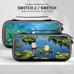 May include: Two black and white Switch 2 / Switch cases with a nature-themed design. The top case features a duck in a pond, while the bottom case shows two cartoon cats on lily pads. The cases have a zipper closure and a carrying handle.