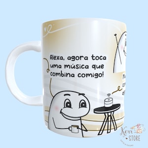 May include: White ceramic mug with a cartoon illustration of a person asking Alexa to play music. The text on the mug reads "Alexa, agora toca uma música que combina comigo!"