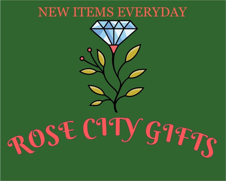 May include: A green background with the text "NEW ITEMS EVERYDAY" in coral. Below is a stylized diamond and floral design, and the words "ROSE CITY GIFTS" in coral script.