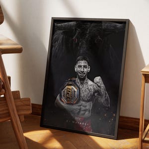 May include: A black and white poster featuring a mixed martial arts fighter holding a championship belt. The fighter is wearing a black tank top and shorts. The poster has a bull's head in the background and the text "El Matador" at the bottom.