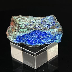 May include: A blue and green azurite and malachite specimen on a clear acrylic display stand.
