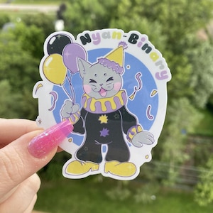 May include: A sticker featuring a cartoon cat dressed as a clown, holding balloons. The cat is gray with a yellow party hat and a black and yellow clown suit. The sticker has the text "Nyan-Binary" in a circle.