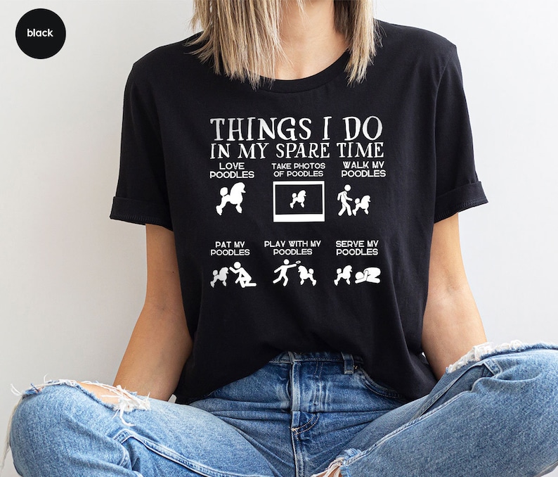 a woman sitting on the floor wearing a t - shirt that says things i do