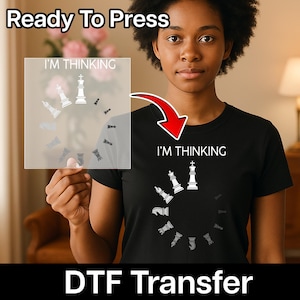 May include: Black t-shirt with the text "I'M THINKING" and a chess piece design. The design includes a white king and other chess pieces arranged in a circle. The words "Ready To Press" and "DTF Transfer" are also visible.