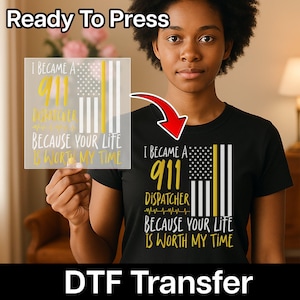 May include: Black t-shirt with a graphic that reads "I BECAME A 911 DISPATCHER BECAUSE YOUR LIFE IS WORTH MY TIME." The design includes an American flag with a yellow stripe. A DTF transfer is also shown.