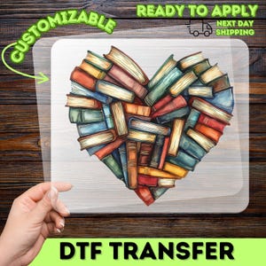 May include: A DTF transfer featuring a heart shape composed of colorful books. The books are in shades of red, blue, orange, and green. The words "CUSTOMIZABLE" and "READY TO APPLY" are printed on the transfer.