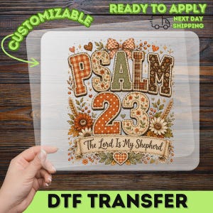 May include: A rectangular DTF transfer sheet featuring the text PSALM 23 in large, patterned block letters with a plaid and floral design. Below the text is a banner reading The Lord Is My Shepherd, surrounded by sunflowers and wheat stalks.