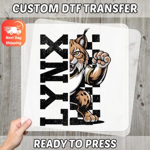 Sporty Wild Cat DTF Transfer, Ready to Press School Spirit Mascot for T-Shirts, Bold Animal Design for Teams & Adventure Groups