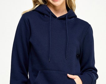 May include: A navy blue hoodie with a drawstring hood and a front kangaroo pocket. The long-sleeved sweatshirt is made of a soft material. The person in the image is wearing the hoodie.