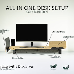 May include: An all-in-one desk setup with a monitor stand, laptop riser, vertical laptop stand, phone holder, and steel shelves. The setup is made of oak and black steel. The text "ALL IN ONE DESK SETUP" is at the top of the image. The text "Oak / Black Steel" is below the first line of text. The text "Organize with Discarve" is at the bottom of the image. The text "etsy.com/shop/Discarve" is below the first line of text. The text "ECO FRIENDLY" is below the image of a leaf. The text "HAND MADE" is below the image of two hands. The text "CUSTOM ORDERS CONTACT US" is below the image of a wrench and hammer.