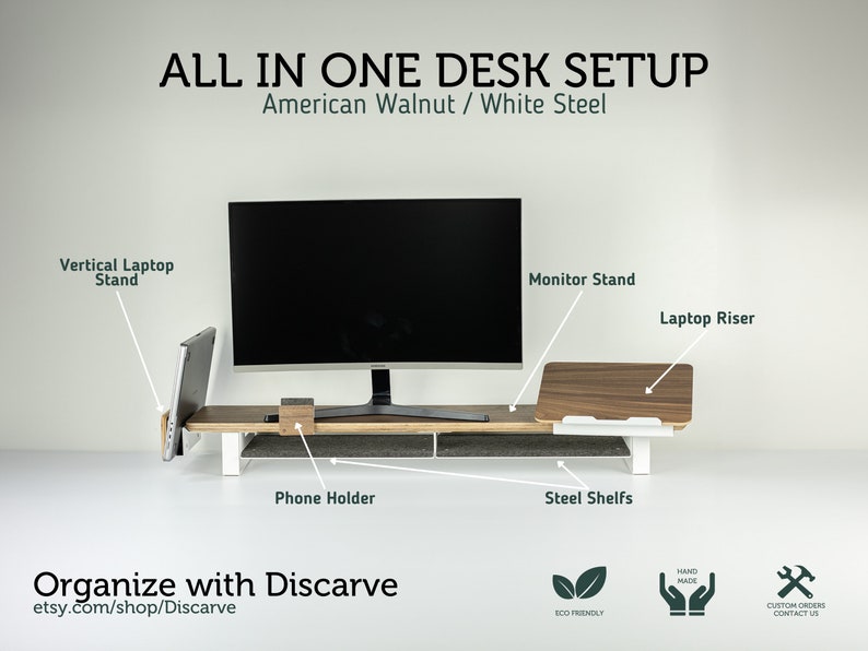 May include: A walnut wood desk organizer with a white steel frame. The organizer has a monitor stand, laptop riser, phone holder, and vertical laptop stand. The text "ALL IN ONE DESK SETUP" and "American Walnut / White Steel" is displayed above the organizer. The text "Organize with Discarve" and "etsy.com/shop/Discarve" is displayed below the organizer. The text "ECO FRIENDLY", "HAND MADE", and "CUSTOM ORDERS CONTACT US" is displayed below the organizer.