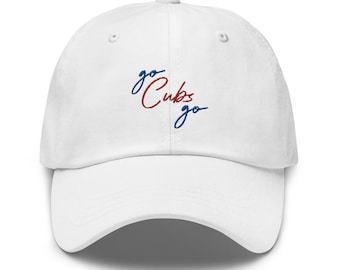May include: White baseball cap with an embroidered design that says "go Cubs go" in red and blue.