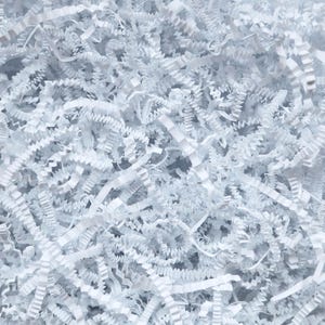 May include: White shredded paper, also known as packing peanuts, is a popular choice for filling gift boxes and protecting fragile items during shipping.