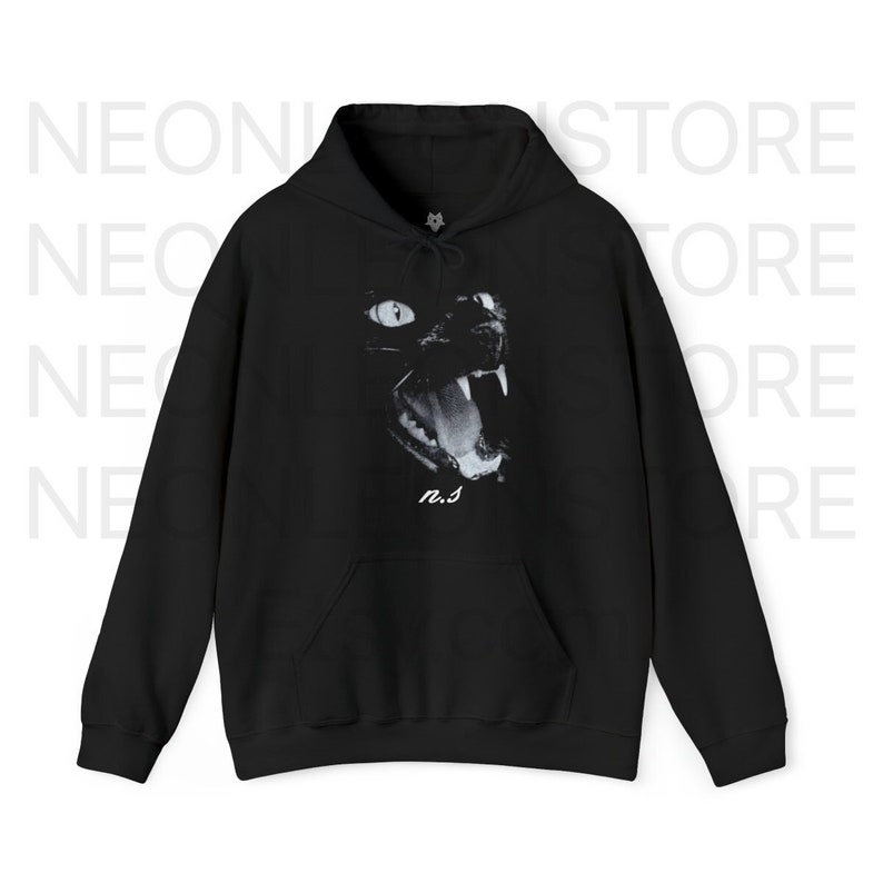 May include: Black hooded sweatshirt featuring a graphic print of a black cat's face with its mouth open, showing teeth. The cat's eyes are white and the print is in black and white. The text "n.s." is printed below the cat's face.