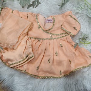 Peach frock with trousers