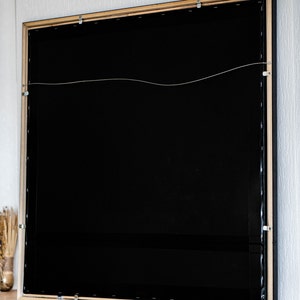 rear part of the painting with the hanging hook and stripe