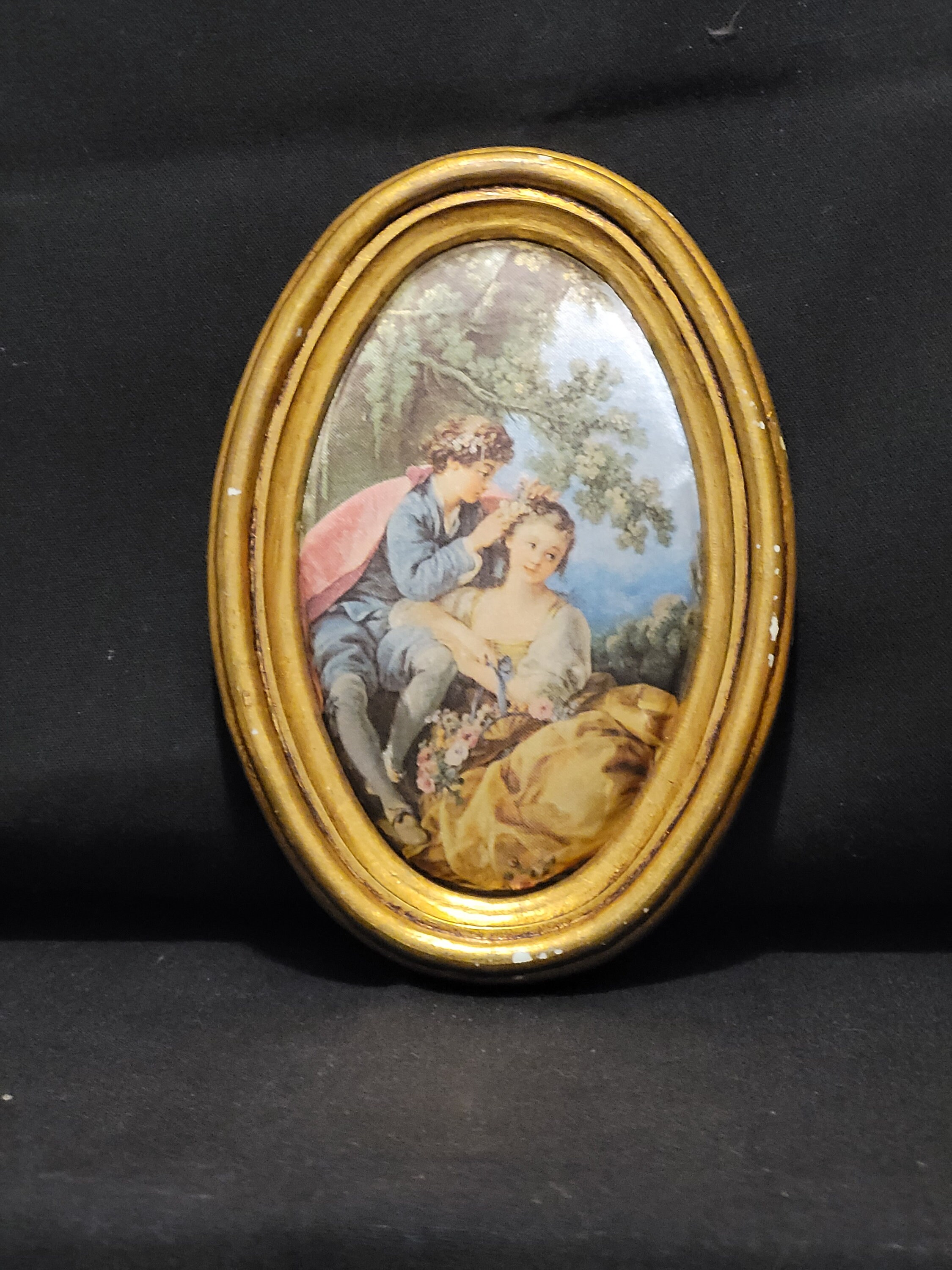 Vintage Renaissance print in oval frame.