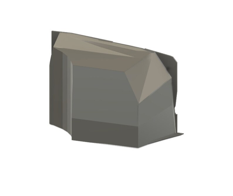 May include: A gray, geometric-shaped object with multiple facets and sharp angles. The object has a modern, abstract design, with a matte finish. The overall shape is reminiscent of a stylized rock or crystal formation.