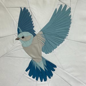 PDF-mönster för quiltblock med pappersdekorationer från Flying Bluebird 2 Foundation.