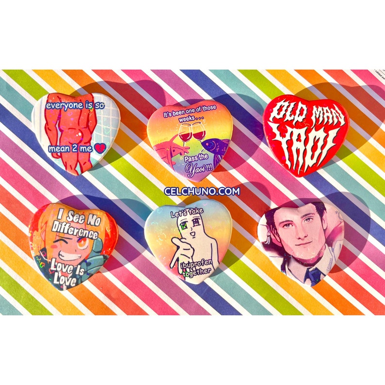 May include: Six heart-shaped pins with various designs and sayings. The pins feature a rainbow background with glitter. The sayings on the pins include "everyone is so mean 2 me", "It's been one of those weeks... Pass the Yaci!!!", "Old Man Yaci", "I See No Difference Love Is Love", "Let's Take Ibuprofen Together", and a pin with a portrait of a man.