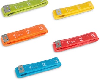 May include: Five colorful measuring tapes, each 60 inches long, are laid out on a white surface. The tapes are green, yellow, orange, red, and blue.
