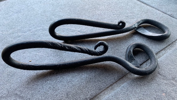 A blacksmith actually hammered this from steel — every one is slightly different, with that raw forge-mark texture you can't get from a factory.