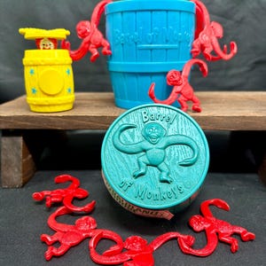 May include: A set of three ceramic vases in varying sizes. The vases have a matte finish in shades of cream, beige, and brown. The tallest vase is approximately 10 inches tall.