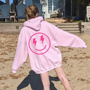 pink lightning smiley face hoodie | trendy women&#39;s hoodie, trendy sweatshirt, cute hoodie, cute hoodies, oversized hoodie, trendy hoodie
