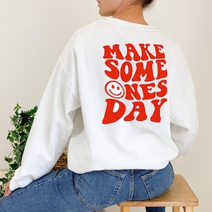 make someone&#39;s day crewneck | trendy women&#39;s sweatshirt, oversized sweatshirt, sweatshirt with words on back, trendy hoodie