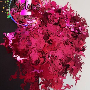 May include: Pink glitter shaped like flamingos. The glitter is perfect for crafting and adding a touch of sparkle to projects.