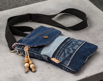 Small mobile phone bag made of upcycled jeans to wear across the body in a patchwork design for women and girls