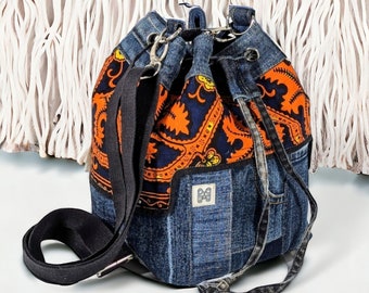 Bucket bag made of recycled jeans / Denim bucket bag with African folklore patterns / Handbag made of jeans with drawstring patchwork design