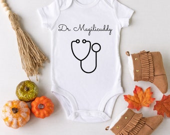 Dr. Magilicuddy Onesie© | White Onesie With Black Font | Funny Baby Clothes | Short Sleeve or Long Sleeve