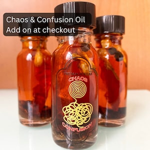 Close-up of two 14mL conjure oil bottles: Chaos and Confusion Oil, crafted for break-up, domination, and revenge spells, and Protection Oil with calming imagery, infused with black obsidian, sage, rosemary, and eucalyptus for grounding and warding.