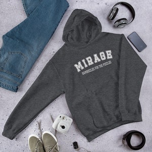 May include: A dark gray hooded sweatshirt with the text "MIRAGE BAMBOOZLES FOR THE FOOLIES" in white.