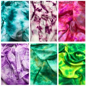 May include: Six different tie-dye fabric swatches in various colors, including teal, purple, pink, and green. Each swatch is labeled with a color number.
