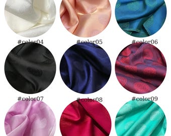 May include: A grid of nine circular fabric swatches in white, peach, blue, black, navy, burgundy, lavender, red, and teal. Each satin-like textile features a repeating circular pattern with intricate detailing labeled #color01 through #color09.