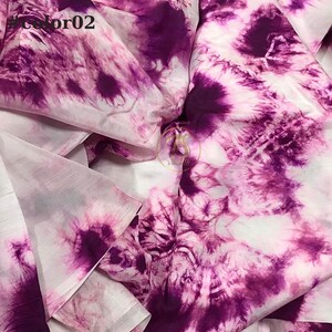May include: White fabric with a purple tie-dye pattern. The fabric is sheer and has a soft, flowing texture.